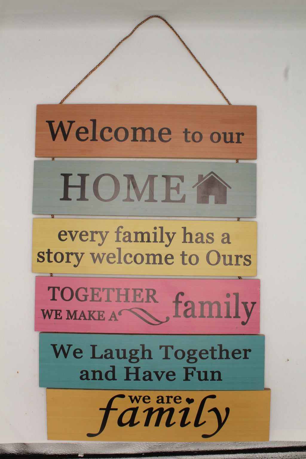 Welcome to Our Home Family Story Rules Multi-Color Hanging Slat Sign